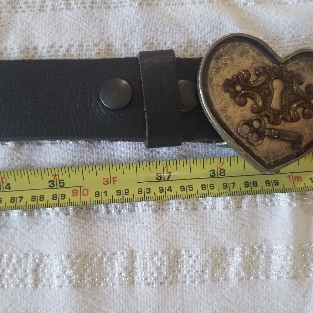 Leather belt with metal heart buckle